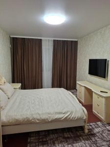 Et tv og/eller underholdning på Cozy apartment