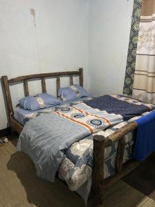 Postel nebo postele na pokoji v ubytování Ikirunga Art Center