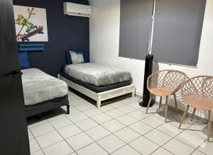 Postel nebo postele na pokoji v ubytování Local Nest in San Juan