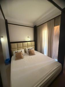 Ένα ή περισσότερα κρεβάτια σε δωμάτιο στο Sunset Pearl APARTMENTS