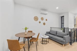a living room with a couch and a table at The Black Nut NYC in New York