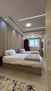 Postel nebo postele na pokoji v ubytování Heart Scarab Pyramids View