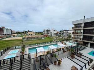 Πισίνα στο ή κοντά στο Oásis do Atlântico Home Clube - Apto 307 com vista para o mar na Praia de Palmas