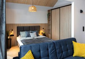 Postel nebo postele na pokoji v ubytování Apartamenty RIO Oława