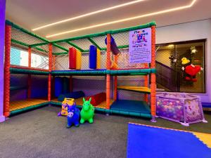 a play room with a play set and some toys at Hotel Estrela do Mar in Penha +24 photos