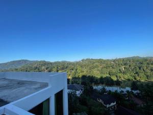a view of the mountains from a balcony of a building at Riverline Resort Kandy in Kandy