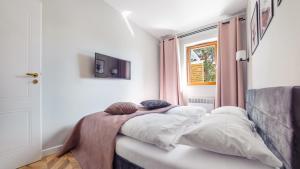 Ένα ή περισσότερα κρεβάτια σε δωμάτιο στο Nautikka Park, Sun & Snow