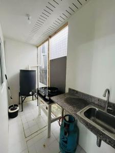 Η κουζίνα ή μικρή κουζίνα στο Nica's place at ORMOC CITY RESIDENCES DEO HOMES