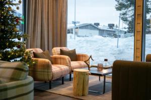 Posezení v ubytování Wilderness Hotel Kieppi