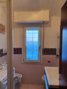 a bathroom with a window and a sink at Domus Mari in Fiuggi +20 photos