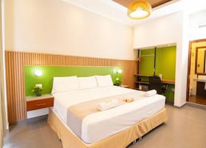 Ένα ή περισσότερα κρεβάτια σε δωμάτιο στο HOTEL SAN JUAN, Tarapoto