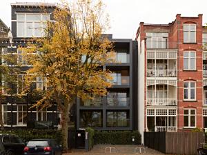 a tree in front of a building at Numa Amsterdam Vondelpark in Amsterdam