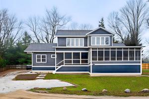 a large house with a blue at The Point on Williams Court in Union Pier