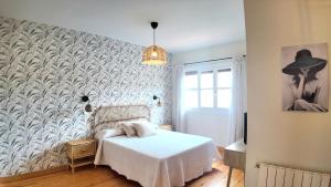 Postel nebo postele na pokoji v ubytování Casa Vacacional Entre Mar y Picos