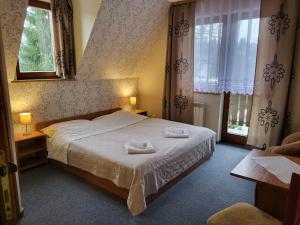 Ένα ή περισσότερα κρεβάτια σε δωμάτιο στο Willa u Tomali +15 φωτογραφίες