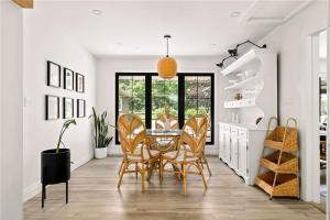 a dining room with a table and chairs at The County Haus - Indoor Pool & Finnish Sauna in West Lake +28 photos