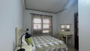 Postel nebo postele na pokoji v ubytování CASA ENTERA PLAYA PUERTO del ROSARIO