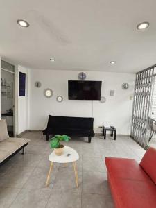 TV a/nebo společenská místnost v ubytování Departamento en Playa San Bartolo Con terraza