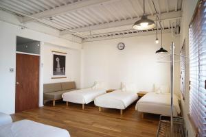 Postel nebo postele na pokoji v ubytování Kuri Apartment