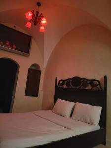 Ένα ή περισσότερα κρεβάτια σε δωμάτιο στο Yeşil periy konaği butik otel