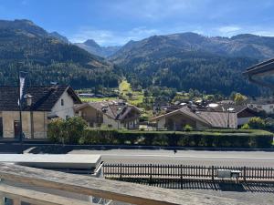 a view of a town with mountains in the background at Appartamento Fontane in Panchia