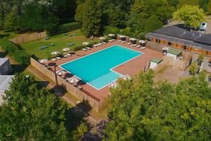 an overhead view of a swimming pool on a house at Hotiday Bologna Arena in Bologna