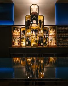 a display case in a store with a lot of bottles at HANNONG Hotel & Wine Bar in Strasbourg