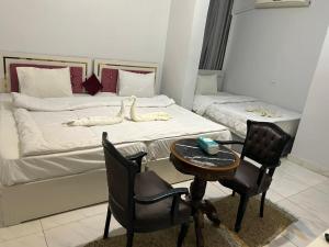 Postel nebo postele na pokoji v ubytování Classic Pyramids inn