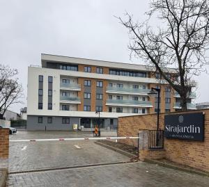 a building with a person standing in front of it at Campus - Palas Moonlight in Iaşi