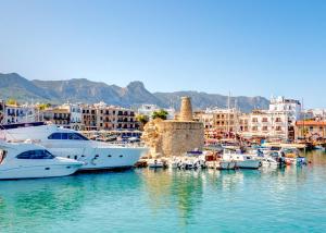 a group of boats docked in a harbor with buildings at Villa Tranquillity by HolidayKeys in Kyrenia