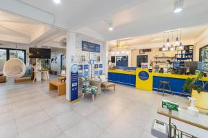 a store with a yellow and blue counter at The Rock Samui Poshtel Lamai Beach in Lamai