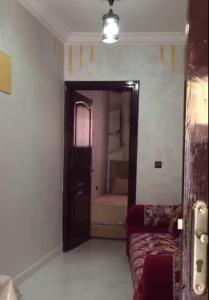 Кровать или кровати в номере Studio meublé AGADIR