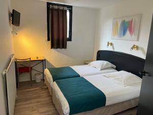 Ένα ή περισσότερα κρεβάτια σε δωμάτιο στο Hôtel Amarante