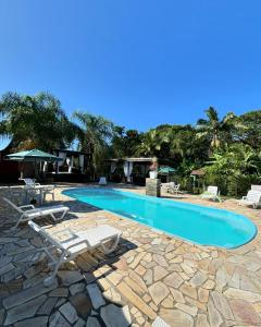 Bazén v ubytování Recanto Carvalho - Suíte 8 nebo v jeho okolí