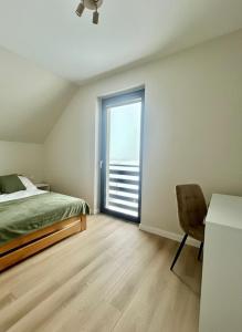 En eller flere senge i et værelse på Na Skarpie