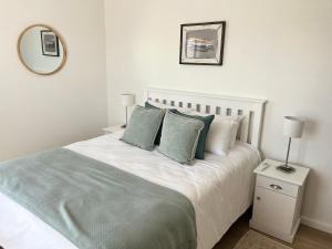 Ένα ή περισσότερα κρεβάτια σε δωμάτιο στο Codrock Cottage