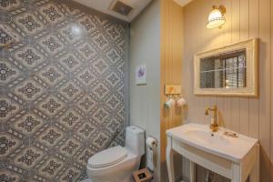 a bathroom with a toilet and a sink at Perennial Resort in Nai Yang Beach +104 photos