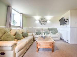 a living room with a couch and a coffee table at 3 Bed in Newton-on-Rawcliffe 88958 in Newton