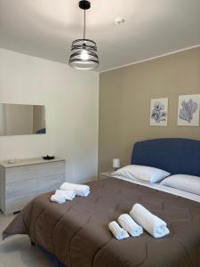 Postel nebo postele na pokoji v ubytování Le Case di Zefiro