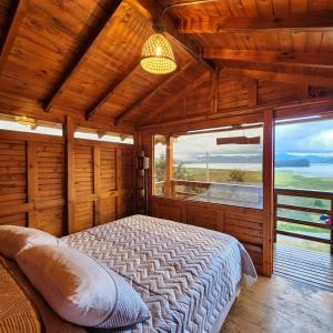 Postel nebo postele na pokoji v ubytování Cabaña Santo Domingo