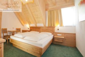 Postel nebo postele na pokoji v ubytování Alpenperle
