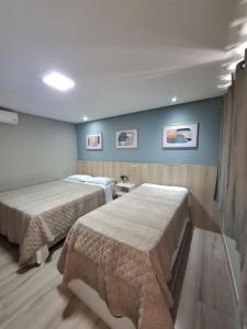 Ένα ή περισσότερα κρεβάτια σε δωμάτιο στο Recanto Carvalho - Suíte 12