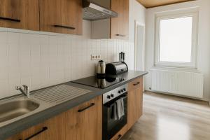 Nhà bếp/bếp nhỏ tại Livemore24 - Space in Herten 24-7 Check-in WIFI +21 ảnh