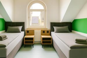 Giường trong phòng chung tại Livemore24 - Space in Herten 24-7 Check-in WIFI