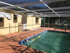 an overhead view of a swimming pool on a patio at PalmBeachDowntownPrivatHouseShare99perpersonupto5Party in West Palm Beach