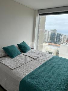 Giường trong phòng chung tại Departamento Concon