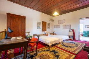 Ένα ή περισσότερα κρεβάτια σε δωμάτιο στο Patriko Country House