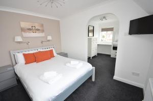 En eller flere senge i et værelse på Broadwater on the river in Wroxham