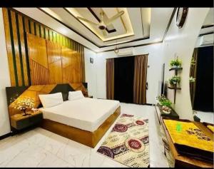 En eller flere senge i et værelse på Karwa Apt