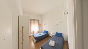 Postel nebo postele na pokoji v ubytování EMMEVI House